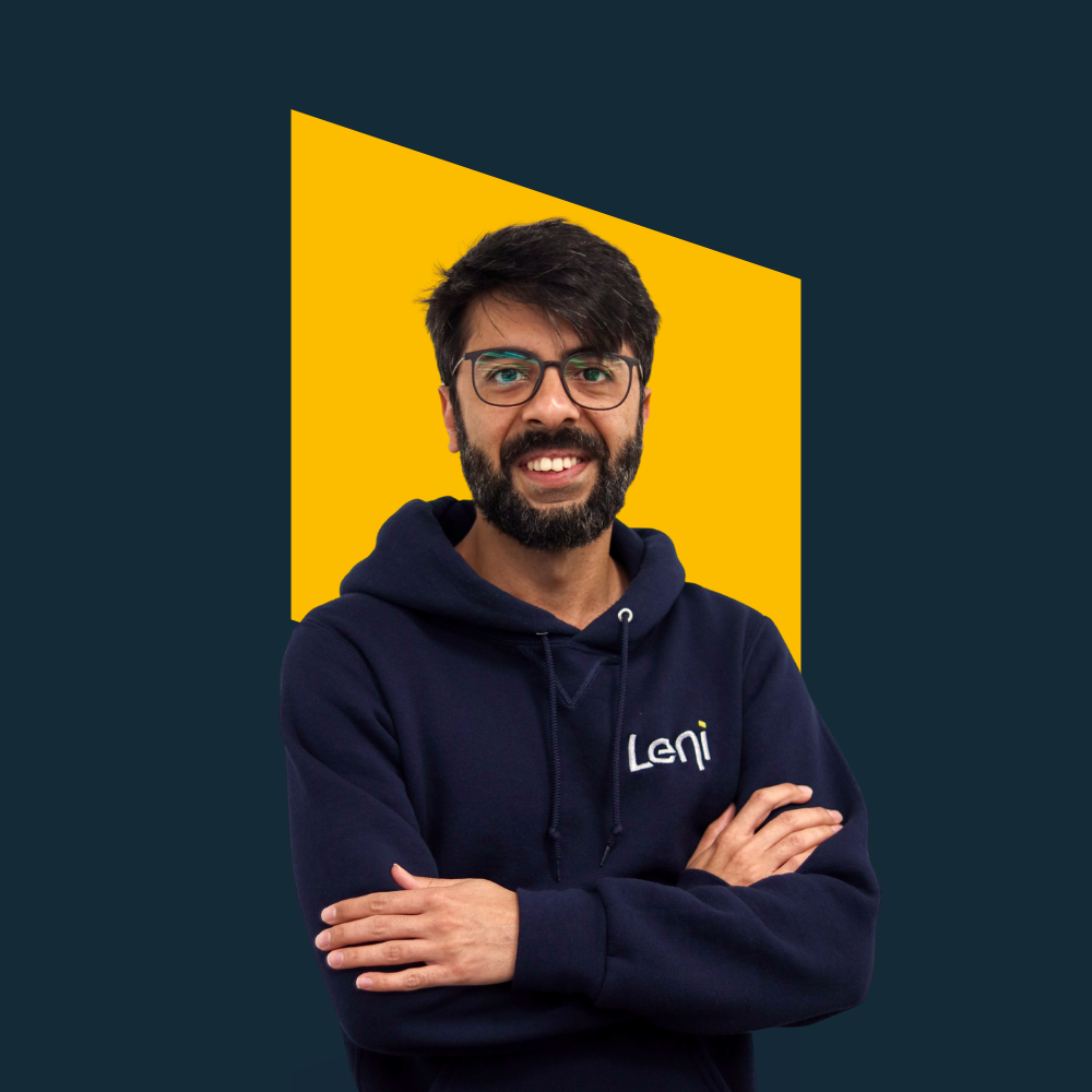 Gaurav, CRO of Leni, in branded hoodie with a yellow background.