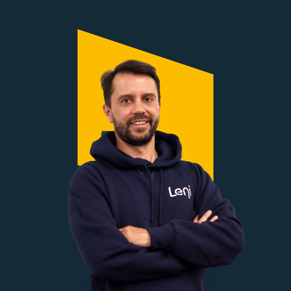 Marcio, Industry Success Lead at Leni, in branded hoodie against yellow geometric background.