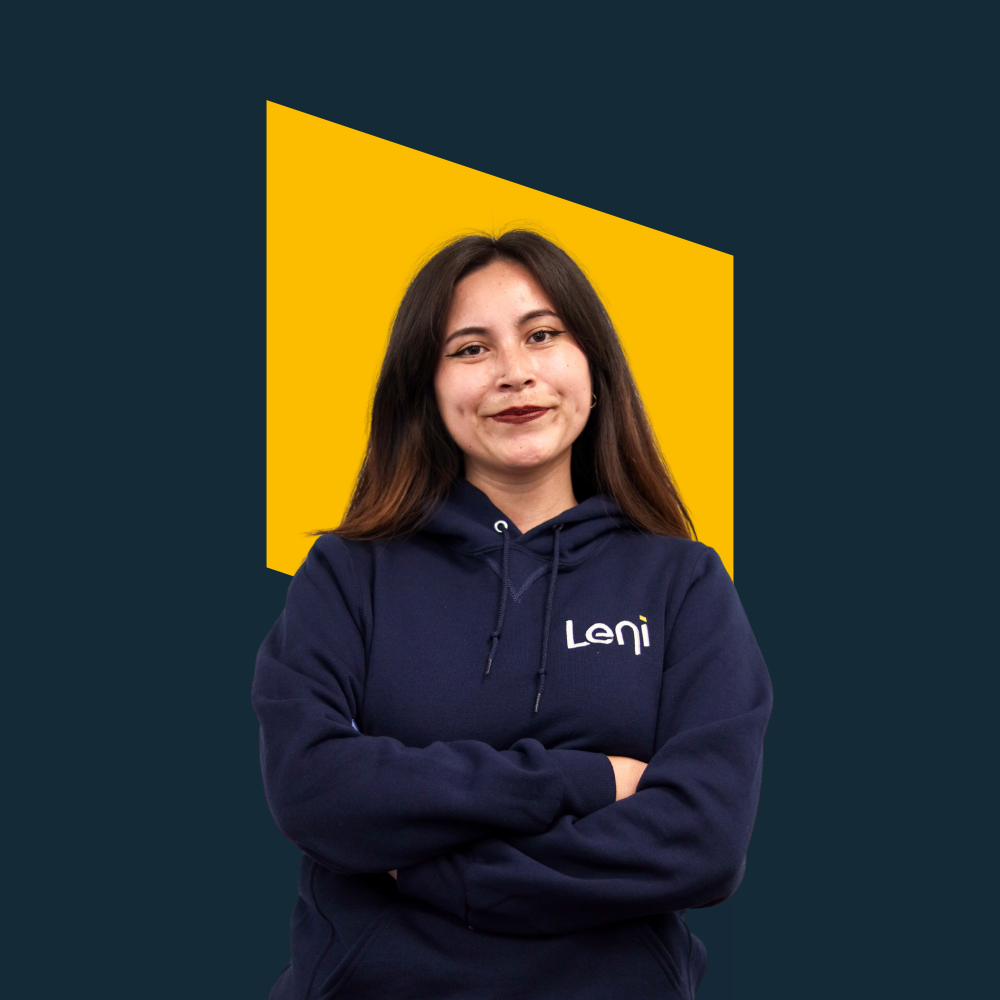 Sthefanny, Marketing Lead at Leni, in branded hoodie against yellow background.